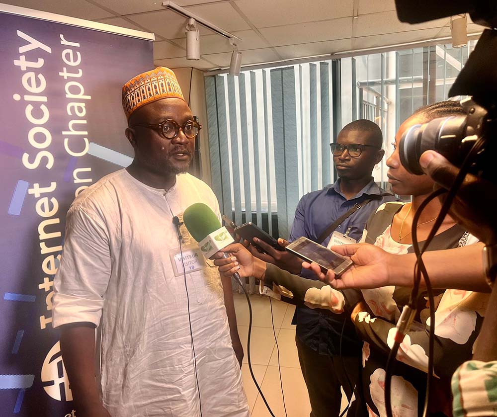 A man speaks into a microphone