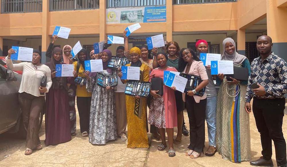 A group of people stand outside at a Guinea Chapter event